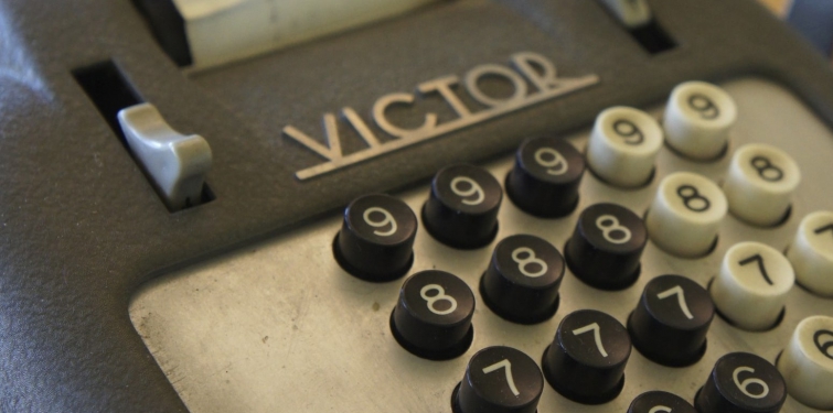 An old desktop calculator with the Victor Technology logo