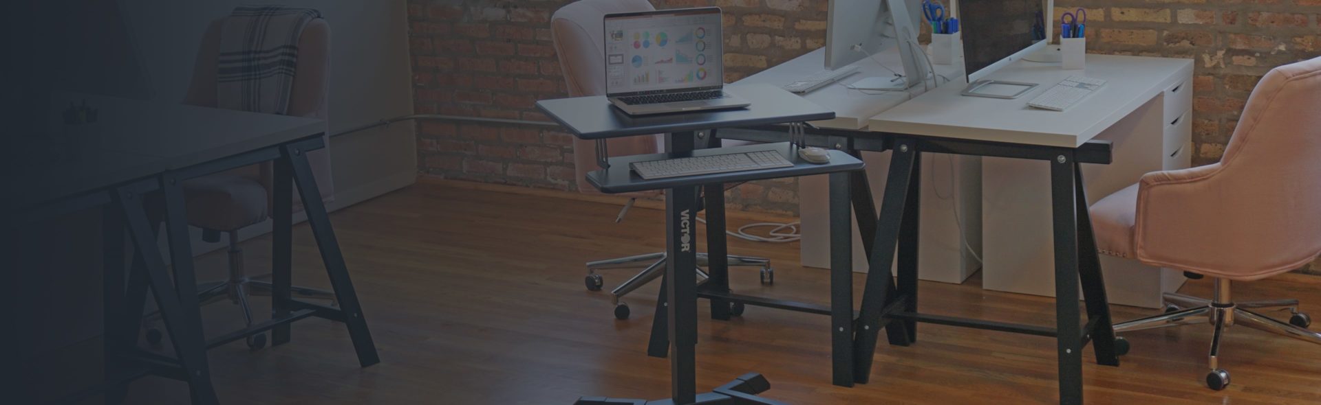 A mobile standing desk is shown in an office setting